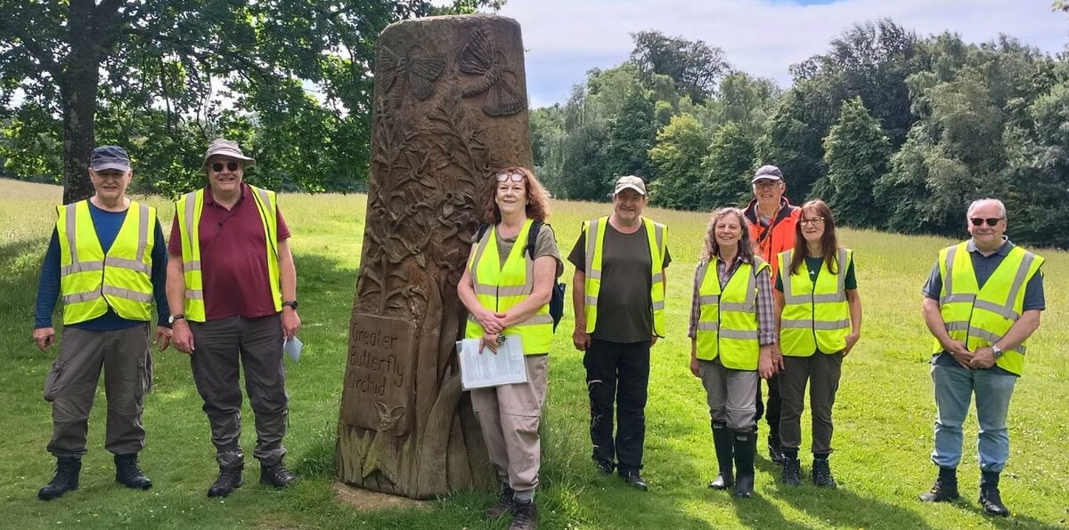 The search team at the carving celebrating the  Greater Butterfly Orchid